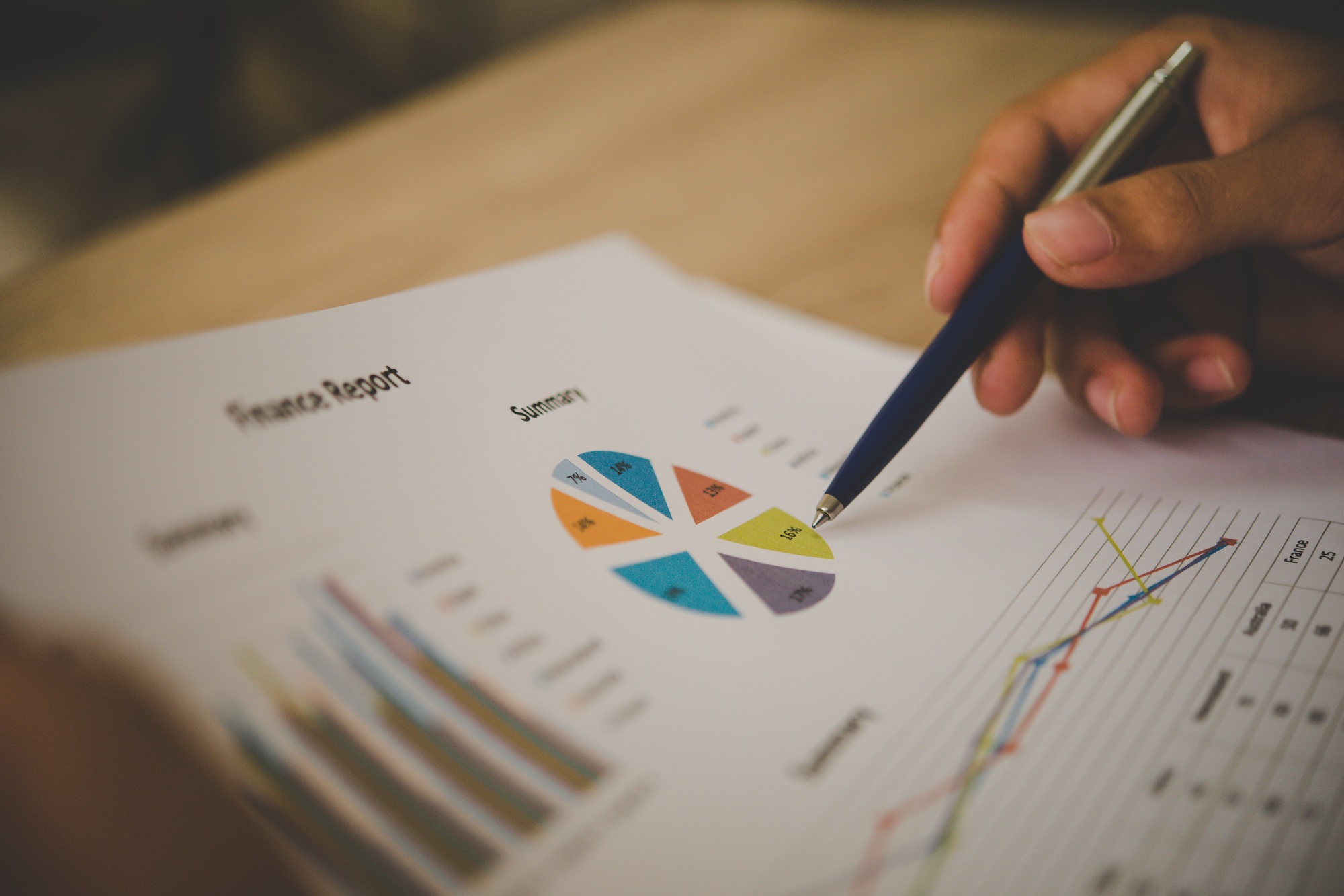 Businessman holding and analyzing investment chart working in office. Business work concept.